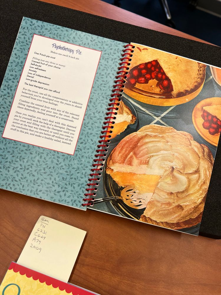 “Psychotherapy Pie” from Nava Peters’ “Secret Recipes for the Modern Wife,” where insecurities are the ingredients for a recipe on brightly colored spiral bound pages riffing on mid twentieth century US cookery. 