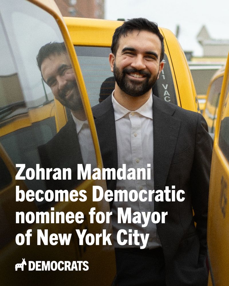 Image of Zohran Mamdani smiling behind a yellow cab with overlaid text, "Zohran Mamdani becomes Democratic nominee for Mayor of New York City"