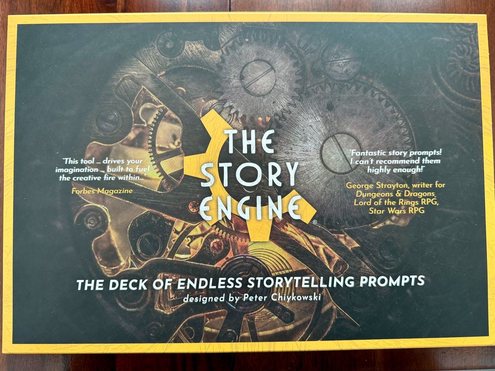 The cover of a boxed set called The Story Engine: The Deck of Endless Storytelling Prompts, designed by Peter Chiykowski. The cover features lots of what look like gears and timepiece parts, as well as a couple of positive blurbs.