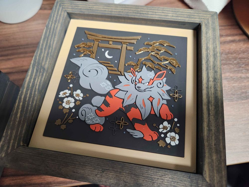 artwork of hisuian arcanine inlayed in a square wooden frame.