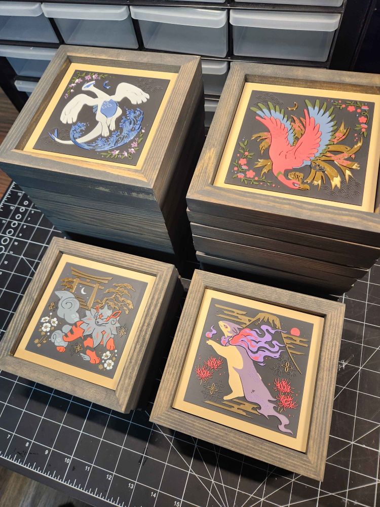 artwork of lugia, ho-oh, hisuian arcanine, and hisuian typhlosion inlayed in square wooden frames