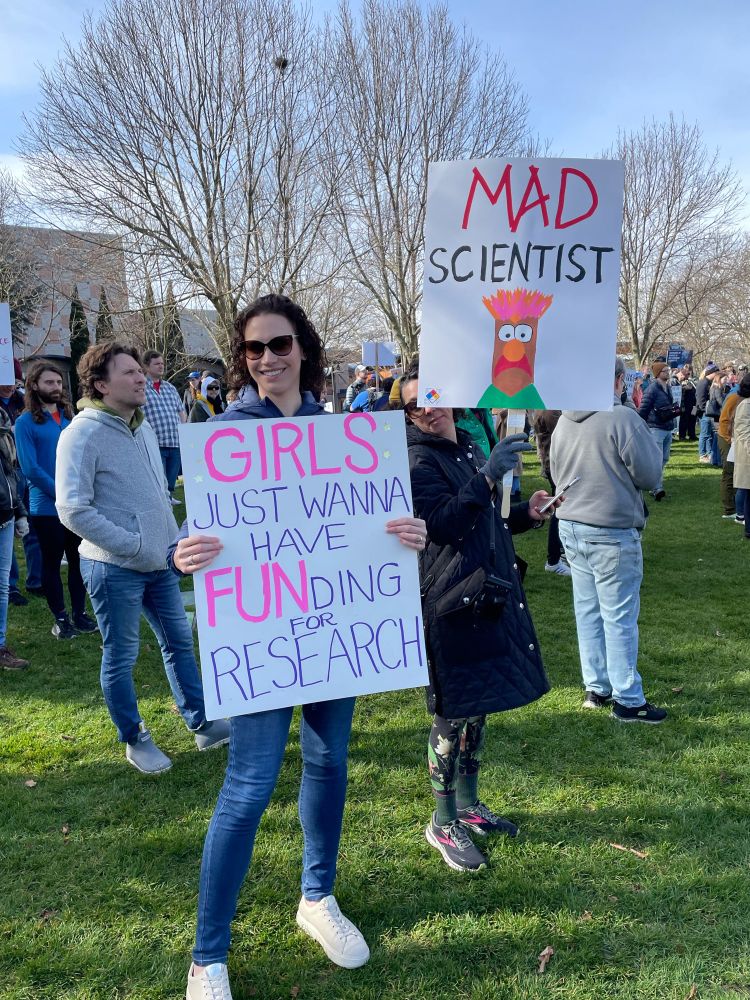 Two more great signs at the science rally. On the left, “GIRLS just wanna have FUNding for research.” On the right, “MAD SCIENTIST” above a picture of Beaker from the Muppets. 