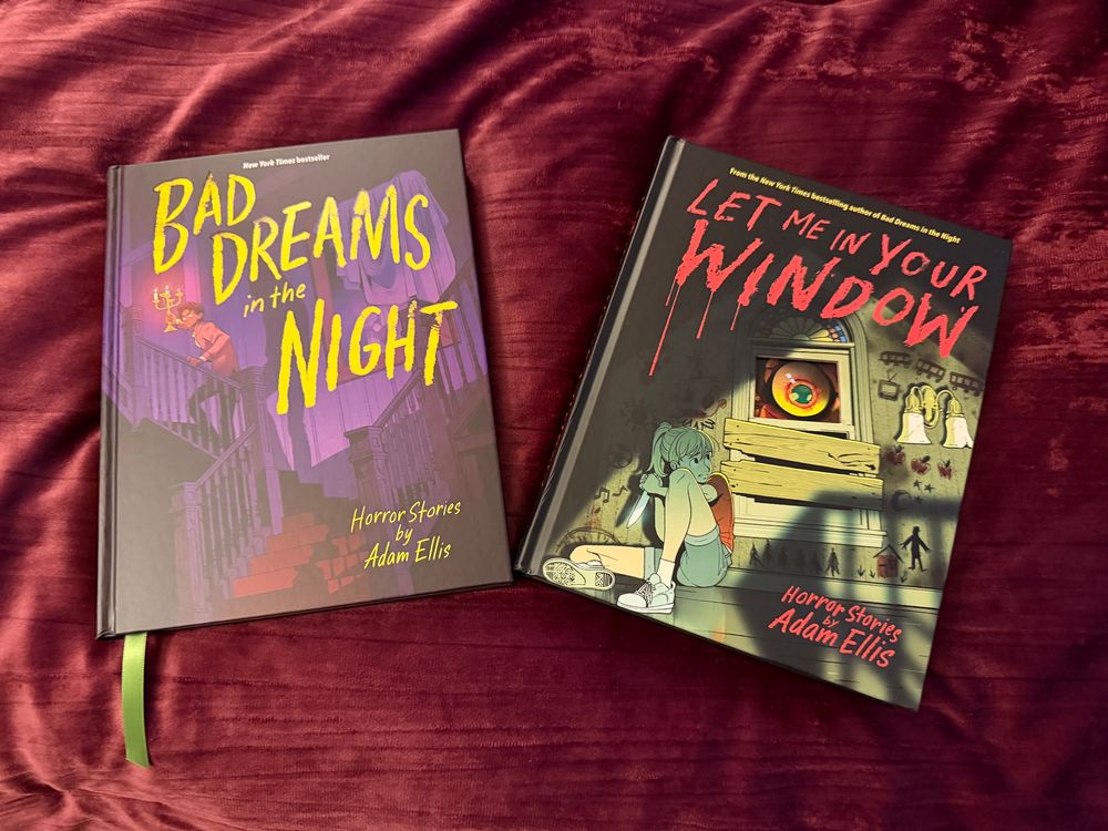 Photo of horror story collectives made by Adam Ellis titled: Bad Dreams in the Night (yellow text, purple indoor background) and Let Me in Your Window (red text)