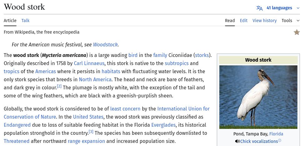 The Wood stork page on wikipedia. It is using Fira Sans font instead of the default sans-serif font in the body. The text reads:

The wood stork (Mycteria americana) is a large wading bird in the family Ciconiidae (storks). Originally described in 1758 by Carl Linnaeus, this stork is native to the subtropics and tropics of the Americas where it persists in habitats with fluctuating water levels. It is the only stork species that breeds in North America. The head and neck are bare of feathers, and dark grey in colour.[2] The plumage is mostly white, with the exception of the tail and some of the wing feathers, which are black with a greenish-purplish sheen.

Globally, the wood stork is considered to be of least concern by the International Union for Conservation of Nature. In the United States, the wood stork was previously classified as Endangered due to loss of suitable feeding habitat in the Florida Everglades, its historical population stronghold in the country.[3] The species has been subsequently downlisted to Threatened after northward range expansion and increased population size. 

