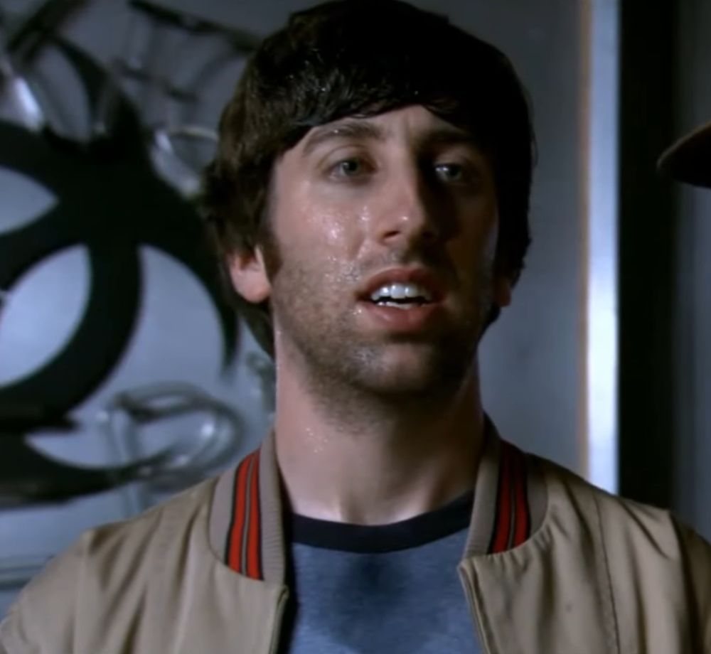 A white guy who looks really slimy in the face and damp at his collar