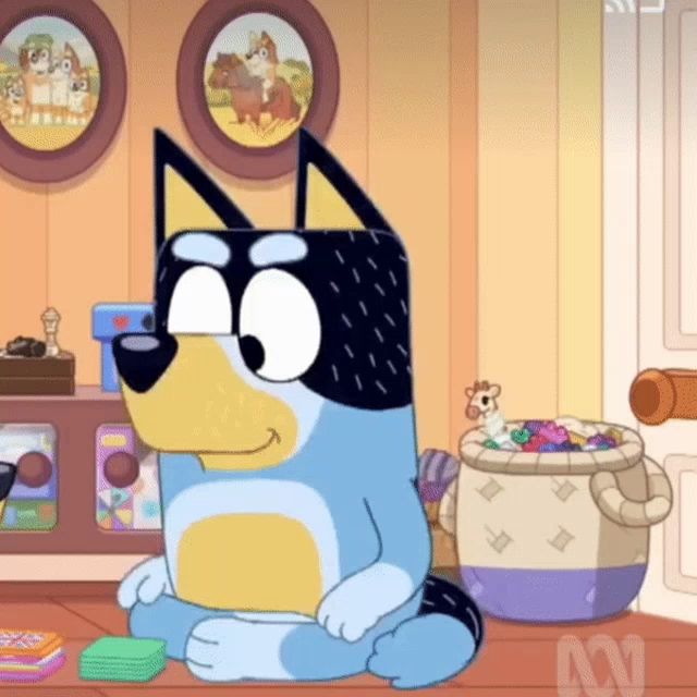 a cartoon dog is sitting on the floor with a basket of toys in the background