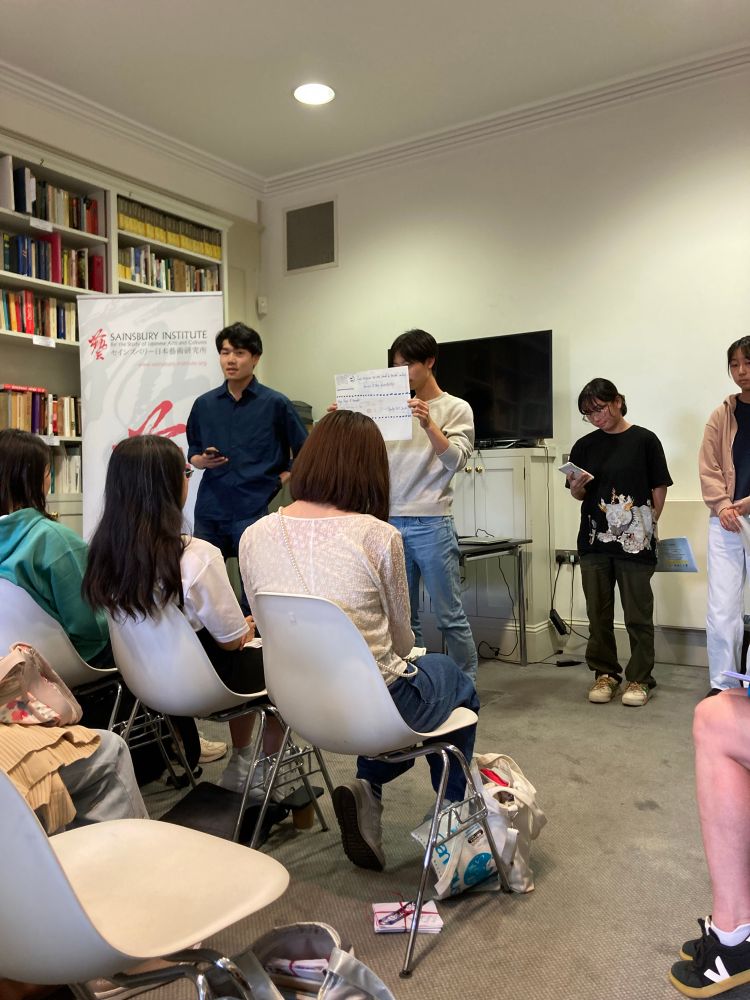 A group of students present in a class room. 
