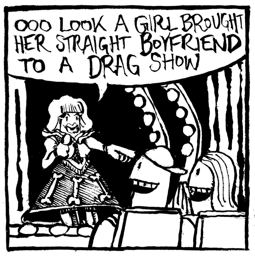 A drag queen wearing a bone-themed frock points to a heterosexual couple in the audience and says 
