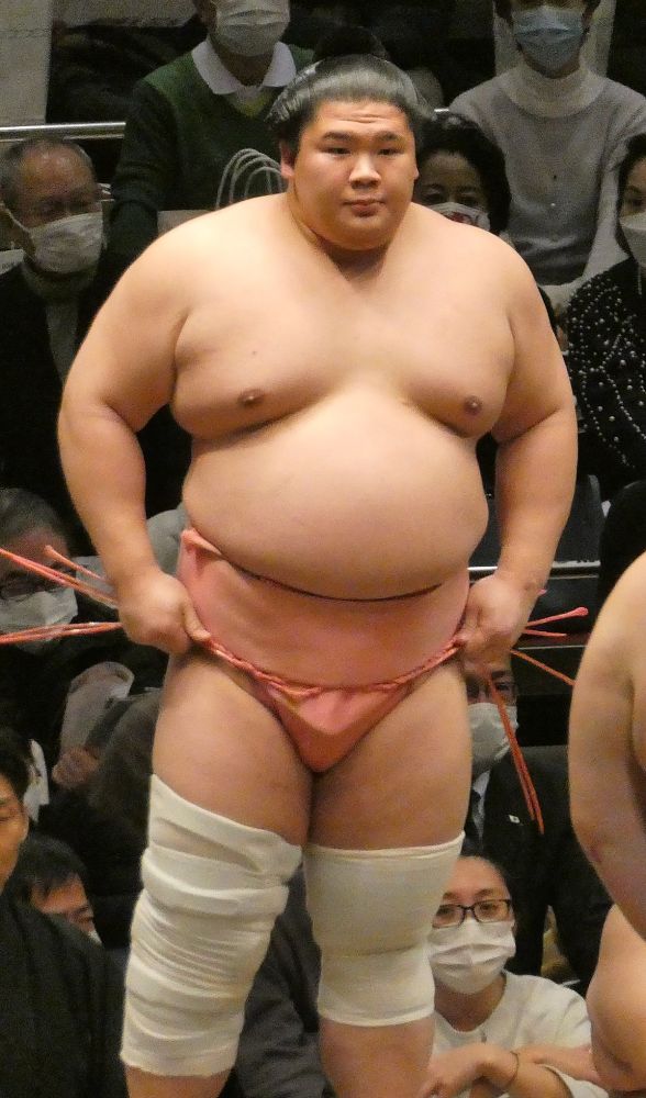 The Sumo wrestler Ura Kazuki, famed for his acrobatic moves, pink mawashi and signature leg bands.