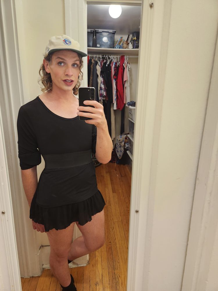 Alex Haus of Decline in small black dress