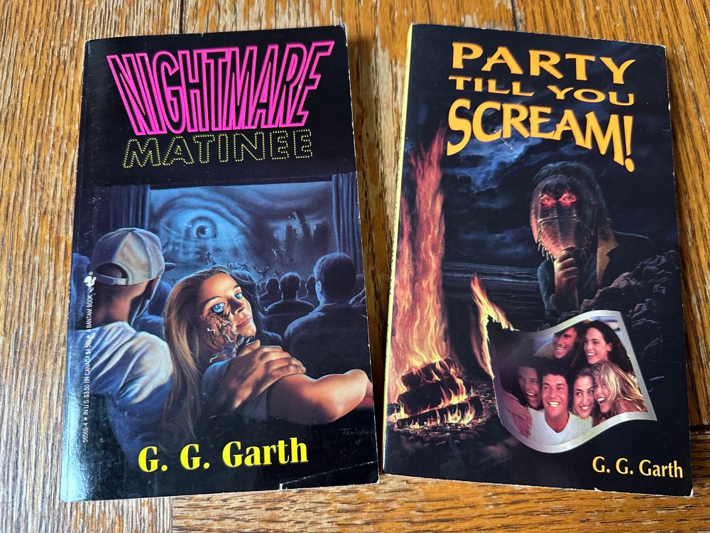 Two books, Nightmare Matinee and Party Till You Scream!, both by G G Garth on a wooden table