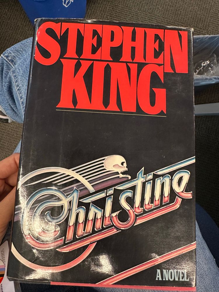 Gem holding a copy of Stephen King’s Christine in hardback
