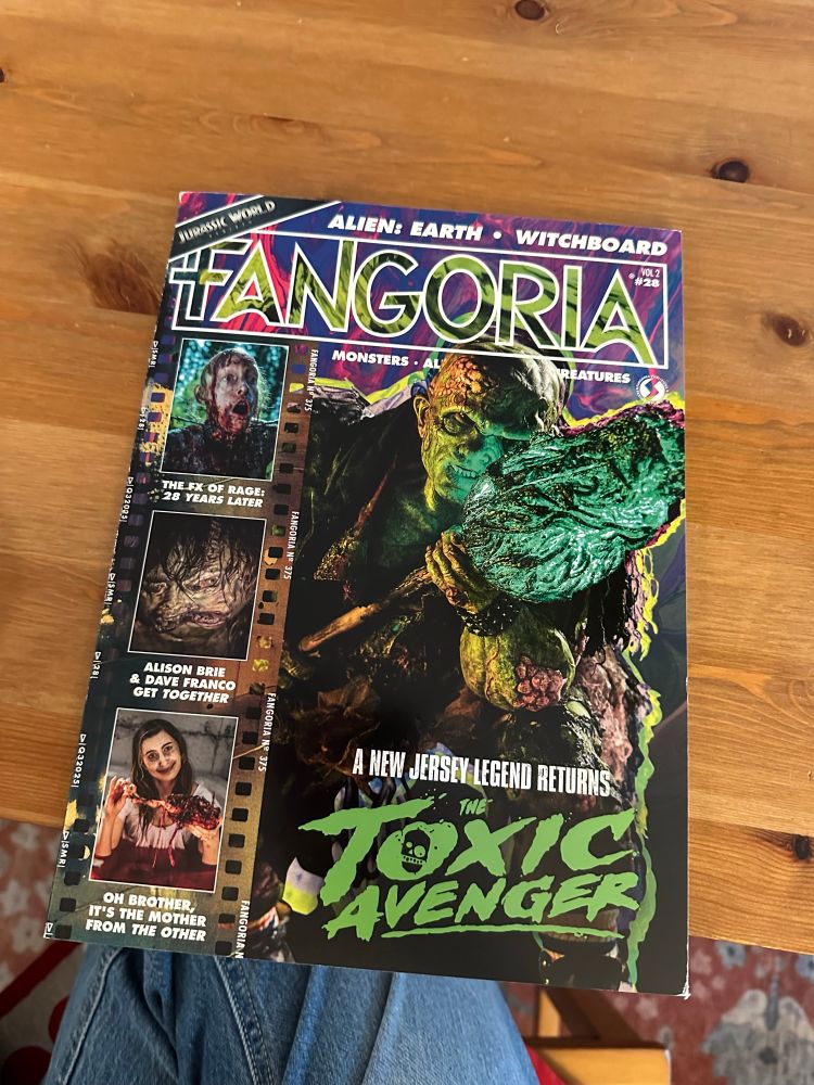 Copy of latest issue of Fangoria on a wooden table.
