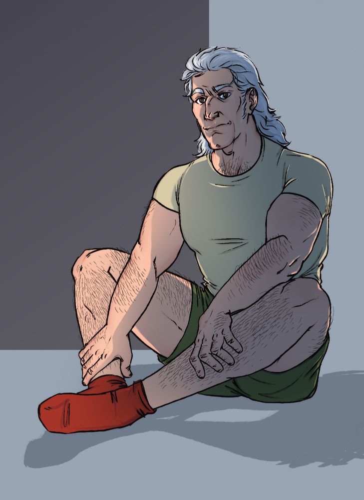 A color illustration of Captain Atom aka Nathaniel Adam, in human form. He's wearing a light green T-shirt, dark green shorts and red socks. He looks peeved or befuddled.