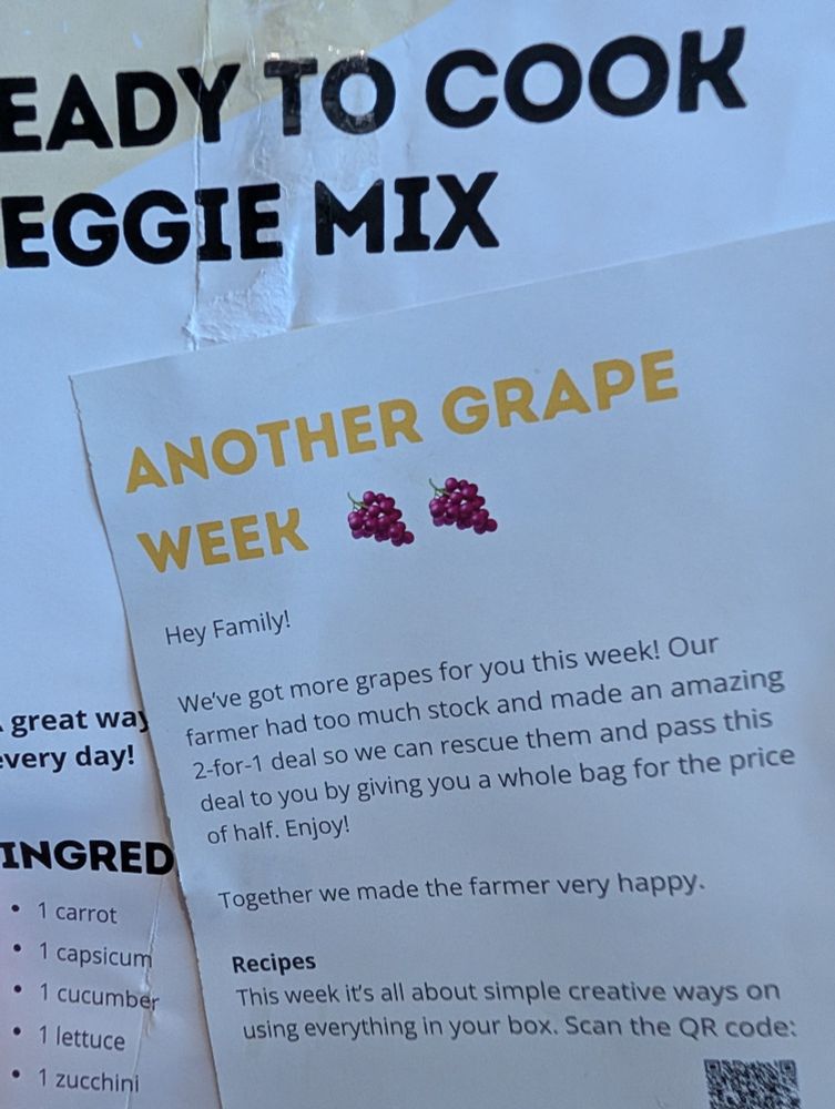 A photo of a flyer advertising, "another grape week: we've got more grapes for you this week! Our farmer had too much stock"