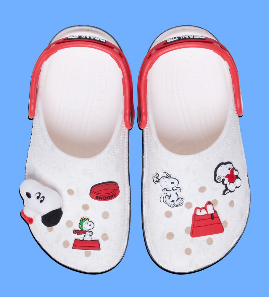 Snoopy themed crocs shoes in white and red with Snoopy themed jibbitz