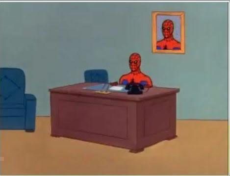Screenshot from the old Spider-Man animated series. Spider-man sits at an office executive’s desk. There is a portrait of Spider-Man on the wall behind him.