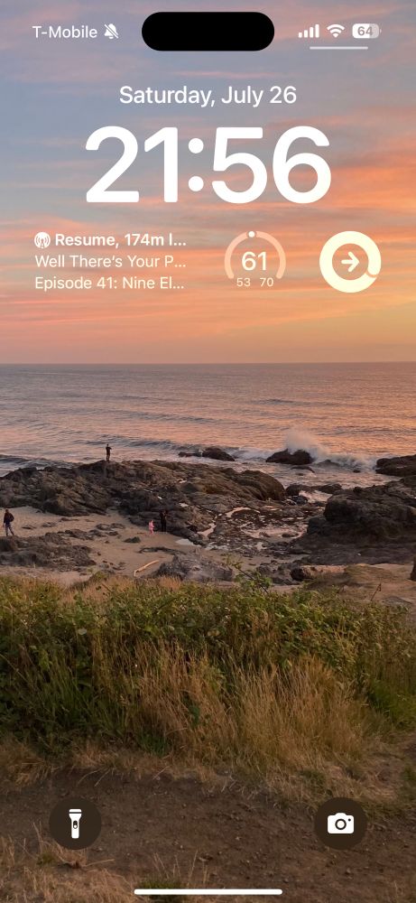 My Lock Screen. A sunset shot looking west plus widgets for time and date, temperature (high 70 low 53, current 61°F), and to continue the current podcast (Well There’s Your Problem episode 41, “Nine Eleven”)