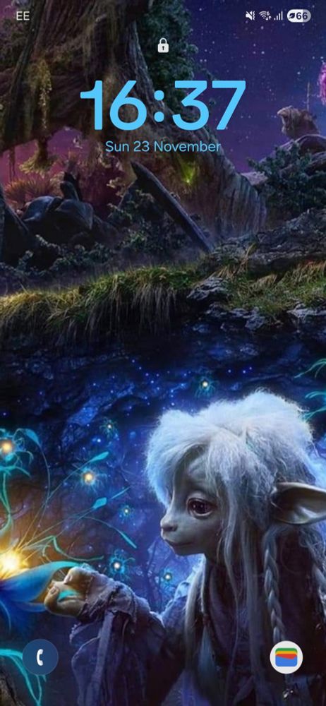A phone lockscreen. The background is of Deet, a Gelfling Character from the Netflix Series The Dark Crystal - Age Of Resistance. Her hand is holding a leaf from a glowing plant. The background of the picture is a fantasy scape with plants and glowing almost ethereal lights and a star covered night sky. The phone's clock, date and various app icons are visible over the background