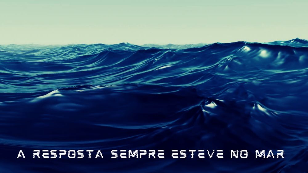 Cena de um mar revolto e a frase "A resposta sempre esteve no mar"