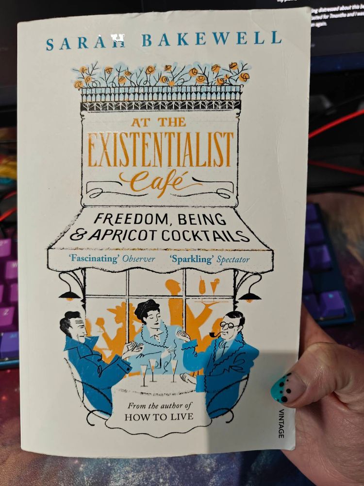 A photo of the paperback version of at The Existentialist Cafe: freedom, being, and apricot cocktails, by Sarah Bakewell