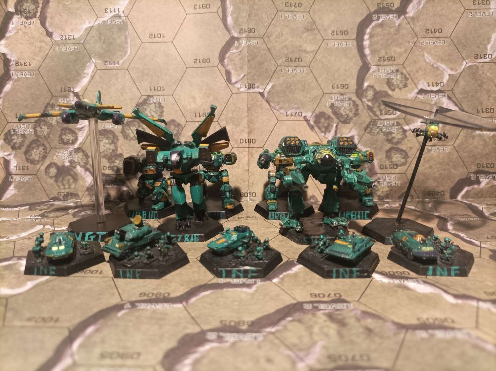 Rear Row : 4 Urbanmech IICs
Mid Row : Visigoth Omni Fighter, Eyrie, Savage Wolf and Mi-2 as a generic VTOL
Front Row : 5 Infantry Platoon stands with a variety of vehicles