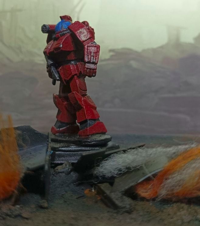 A 1st Sword of Light Griffin stands tall amongst the smoke and flame. 