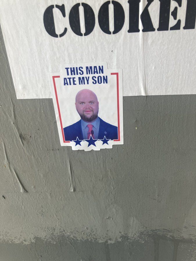 A sticker with a JD Vance enlarged head meme saying “this man ate my son.” 