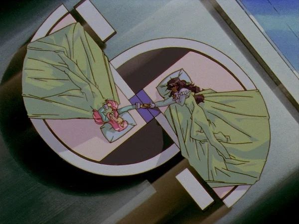 Utena and Anthy from Revolutionary Girl Utena holding hands on the odd S-shaped bed.