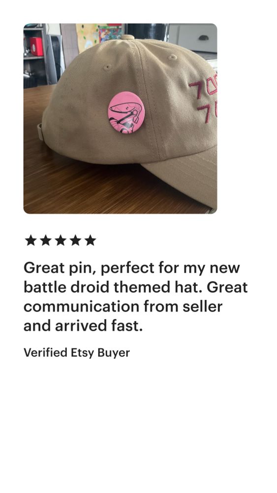 Photo of a hat with a B1 Battle Droid pin attached to it with text from the Verified Etsy Buyer stating: Great pin, perfect for my new battle droid themed hat. Great communication from seller and arrived fast.