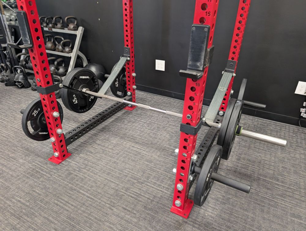 A deadlift bar with 90 pounds on either side. 
