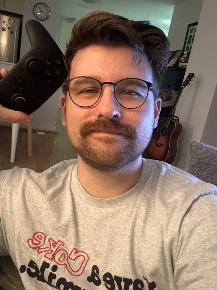 v tired goofy goober holding a new switch 2 pro controller