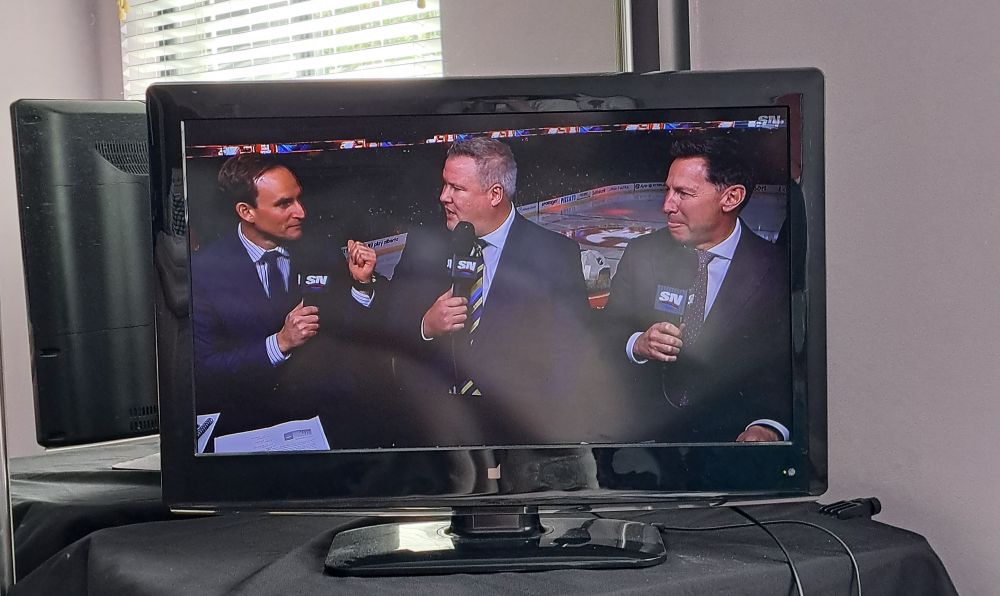 View of a tv screen from bed