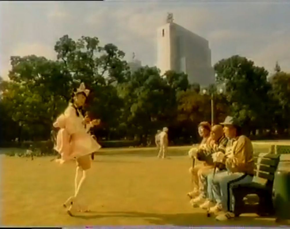 a woman dressed in lolita fashion asks some golfers if they want to play pokémon.