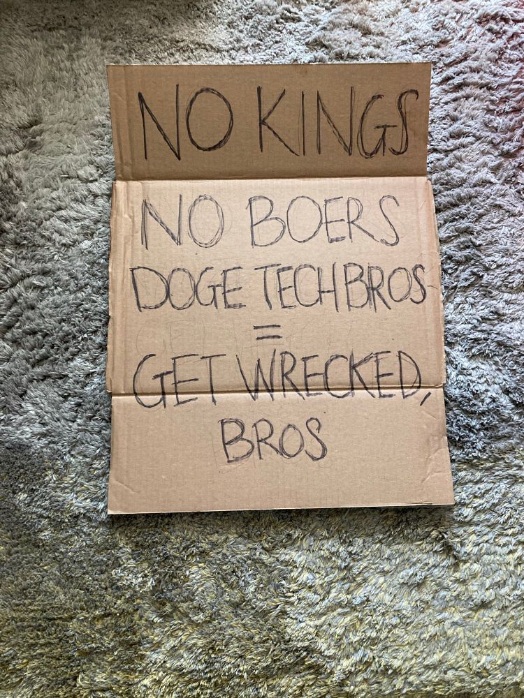 Protest sign “No Kings No Boers DOGE Tech Bros GET WRECKED BROS” 