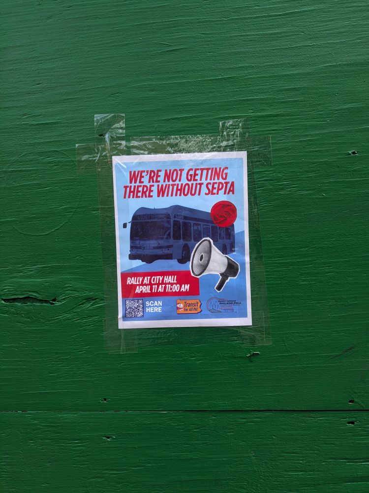 Flyer with a bus and a megaphone that says "We're Not Getting there Without SEPTA: Rally at City Hall April 11th at 11:00AM" taped to a green wall