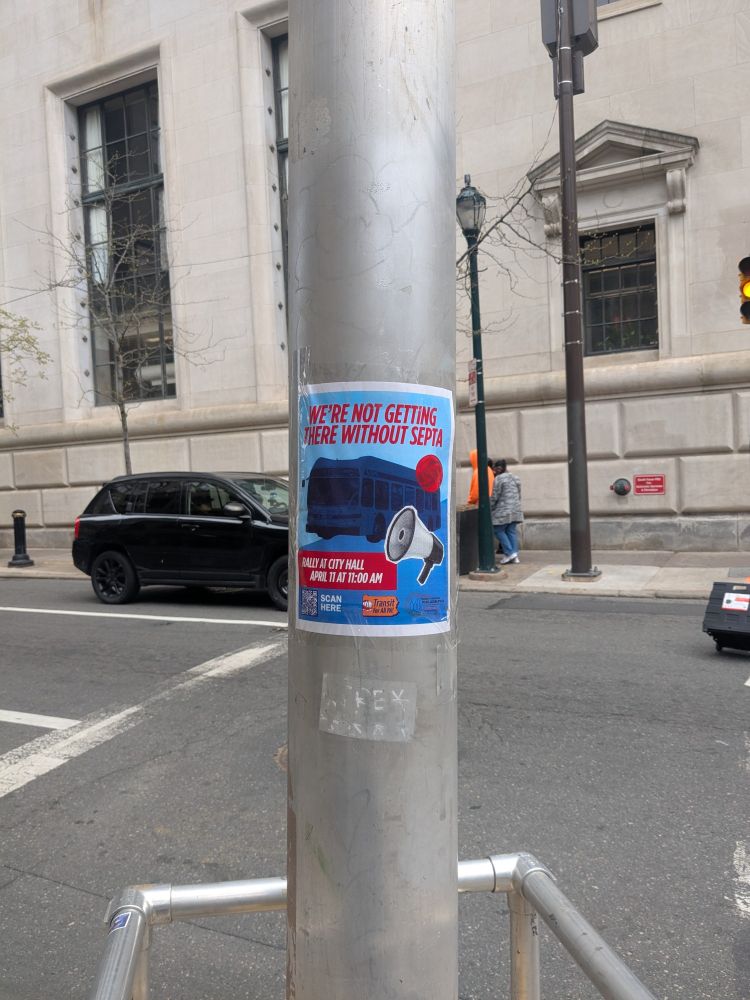 Flyer with a bus and a megaphone that says "We're Not Getting there Without SEPTA: Rally at City Hall April 11th at 11:00AM" taped to pole