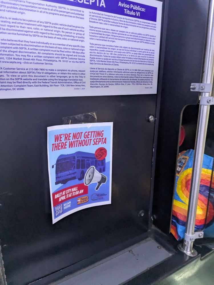 Flyer with a bus and a megaphone that says "We're Not Getting there Without SEPTA: Rally at City Hall April 11th at 11:00AM" taped to the inside of the 12 bus