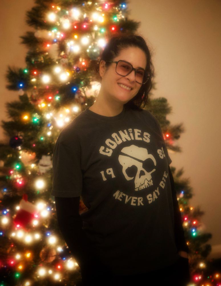 Christen Lien in front of a Christmas tree