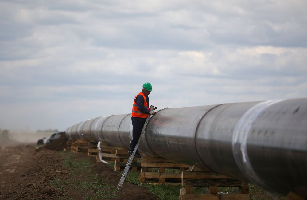 A worker is seen next to a pipe at a construction site on the extension of Russia's TurkStream gas pipeline.