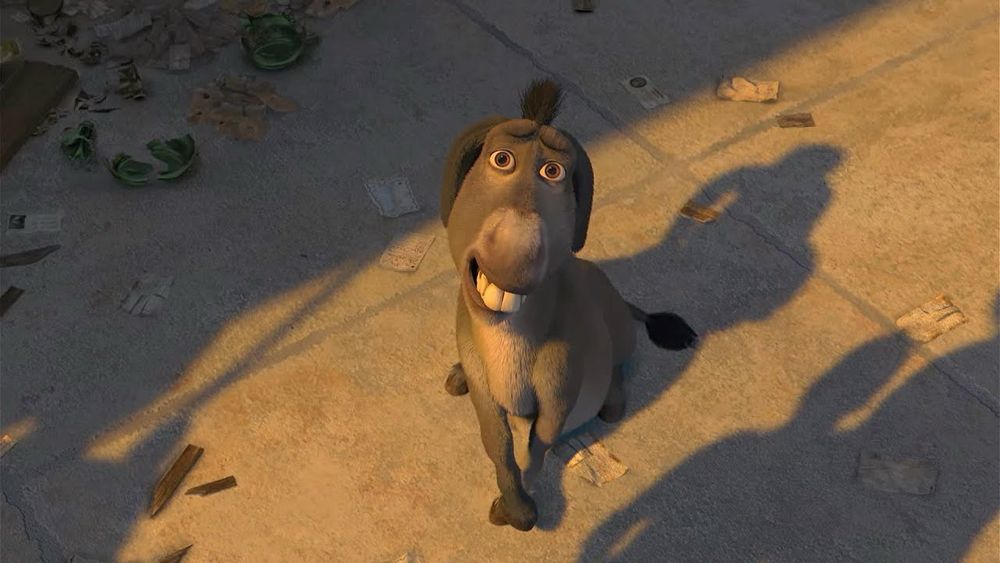 Donkey smiling awkwardly still from Shrek 3. 