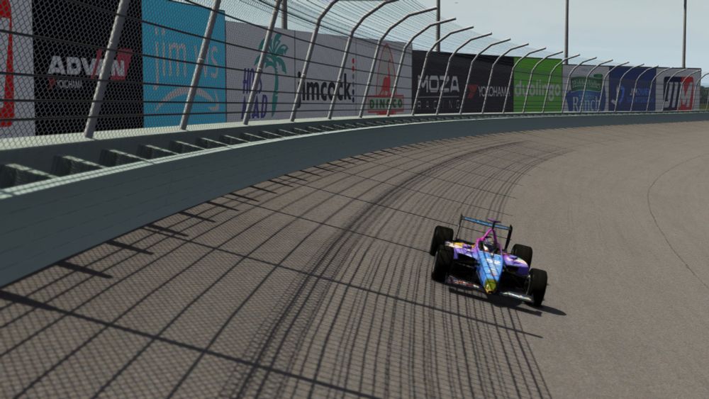 Nifty's DP01 racing the highline at Homestead. One of the billboards says "Hoes Mad" and that makes Nifty giggle a little.