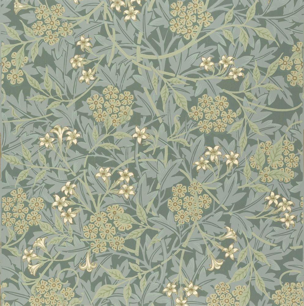 William Morris's 'Jasmine' wallpaper. Dense pattern of jasmine and hawthorn blooms and foliage, in blueish and yellowish shades of green.