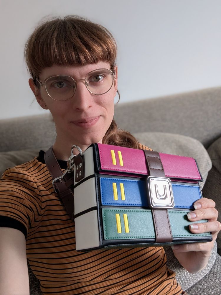 A photo of me holding the WinRAR bag