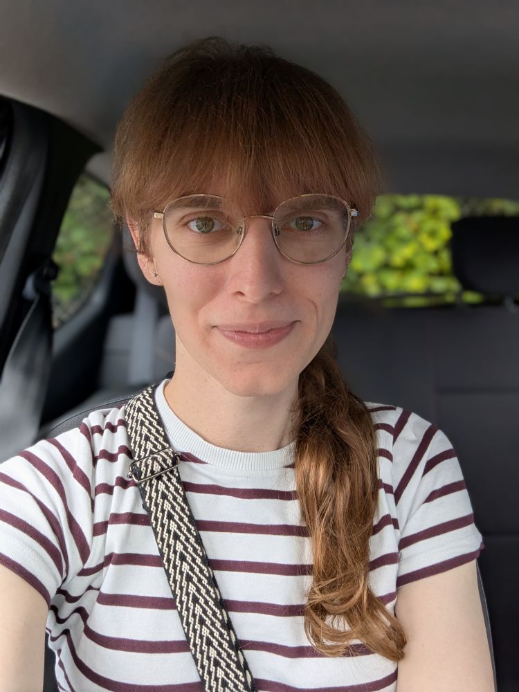 It's a photo of me with a messy fringe, and I'm wearing a striped t-shirt