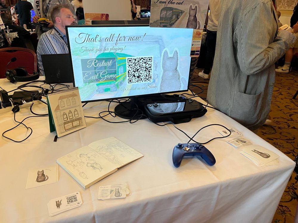 Indie game booth with concept sketches at Brilliant Indie Treasures in Brighton, UK.