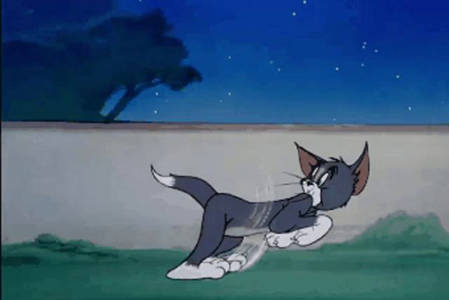 a tom and jerry cartoon shows tom kicking jerry