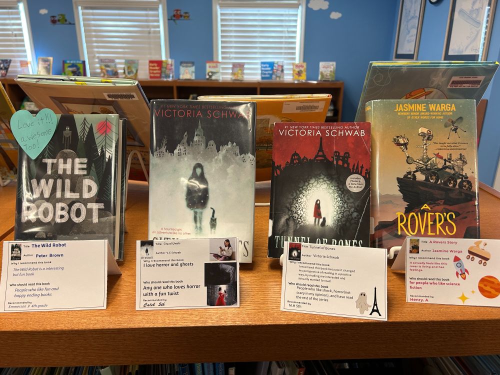 Students created shelf talkers for favorite books like The Wild Robot and a Rover's Story