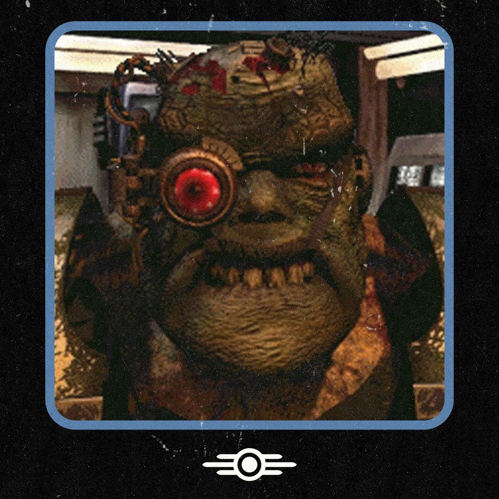 A screenshot from Fallout 1 showing Lieutenant. He is a Super Mutant heavily modified with cybernetics, including a large artifical red targeting eye. He is wearing T-51b Power Armor shoulder pouldrons and is stood inside the Mariposa Military Base.