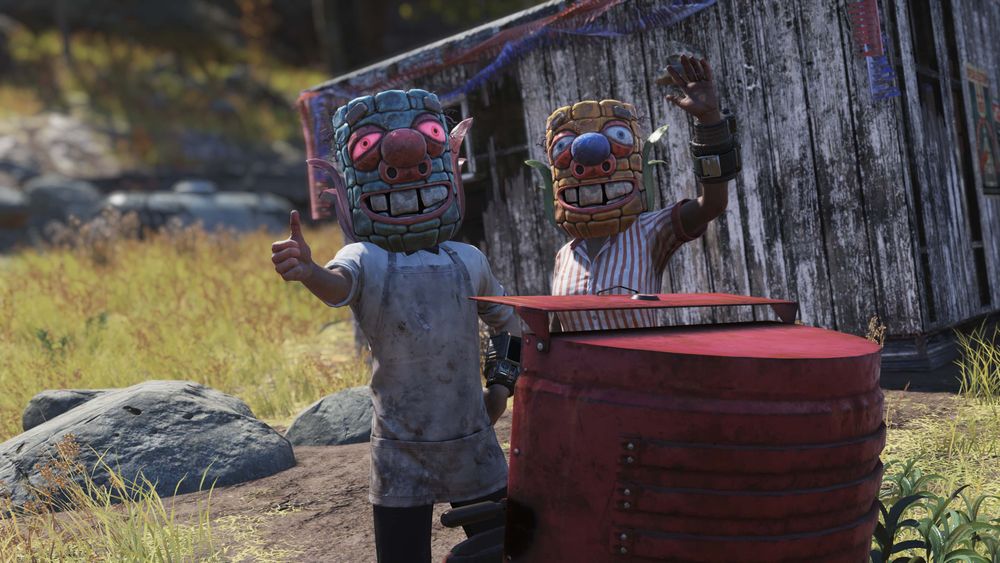 Screenshot in Fallout 76 of two characters wearing colorful masks that resemble a corn cob.